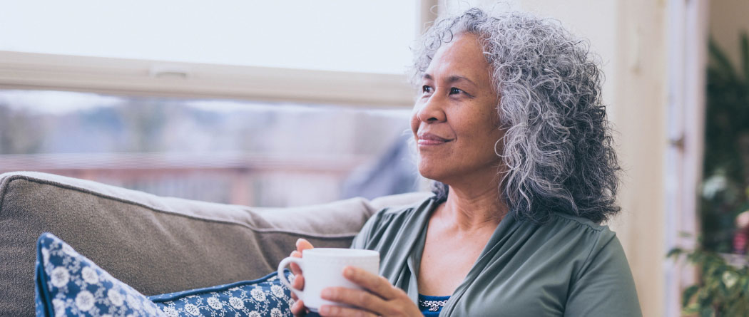 mature woman holding a coffee cup