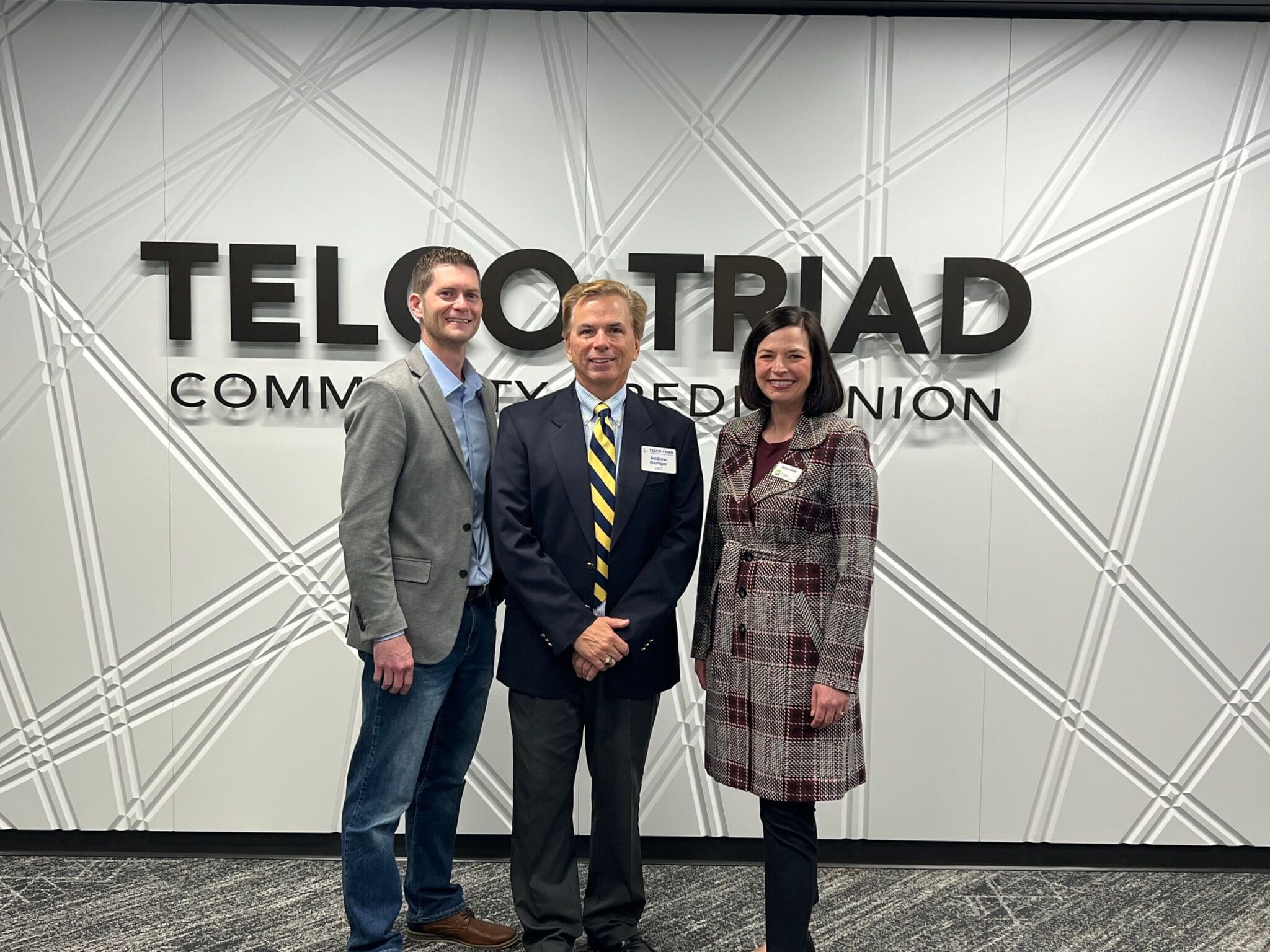 posed in front on new main building interior